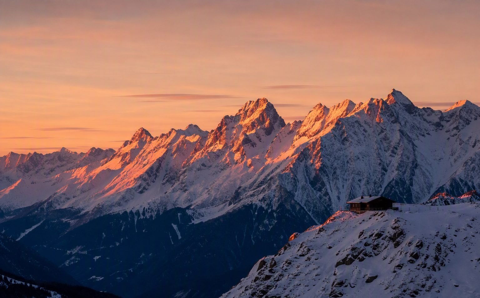 Stubai Alps ridge at sunset with alpenglow on snow-covered peaks